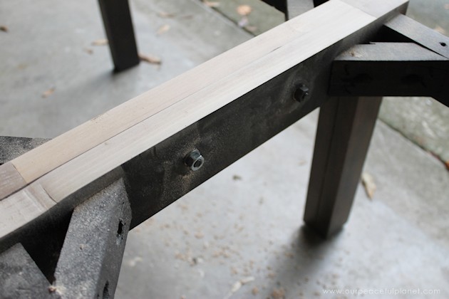 Watch how two $2 thrift store office chairs were transformed into a gorgeous comfy bench seat with nothing more than some paint and $6.00 of material.