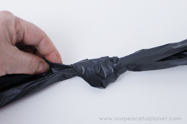 Need quick, low cost awesome looking Halloween decorations? Go to your cupboard, grab some black plastic trash bags & make a large creepy bat in 5 minutes!