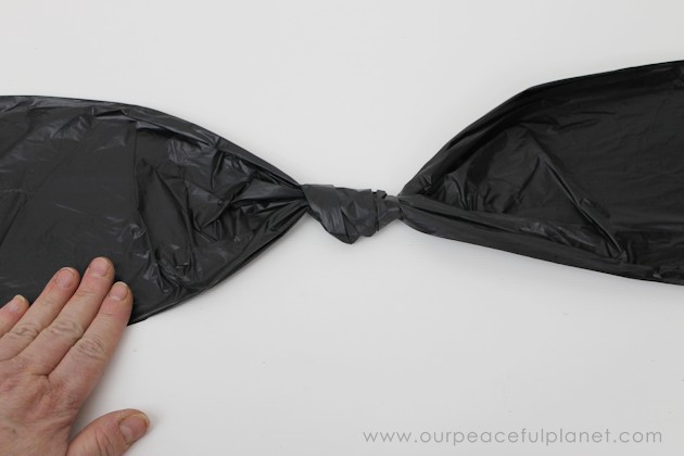 Need quick, low cost awesome looking Halloween decorations? Go to your cupboard, grab some black plastic trash bags & make a large creepy bat in 5 minutes!