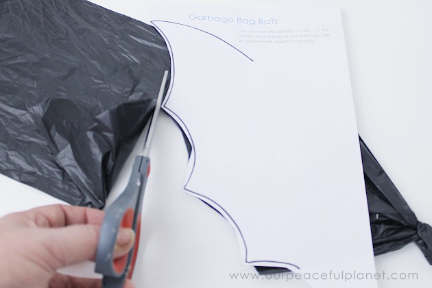 Need quick, low cost awesome looking Halloween decorations? Go to your cupboard, grab some black plastic trash bags & make a large creepy bat in 5 minutes!