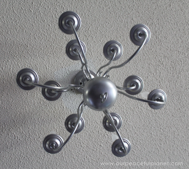 A simple chandelier makeover using a chandelier found at a thrift store. It replaced a ceiling fan in and was flush mounted. The effect was stunning!
