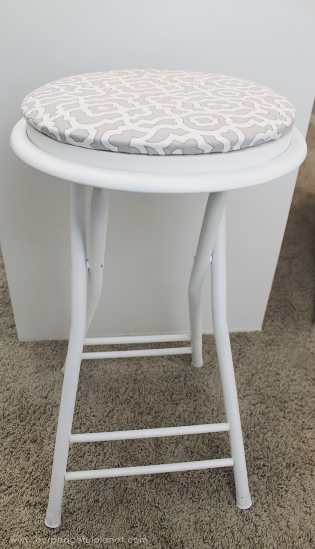 This cheap folding stool from Amazon was for my craft room. It just needed a little love. i.e. paint and material plus a wood circle to make it tad higher. I also added the feature of making the fabric top removable in case I want to change the color at some point.