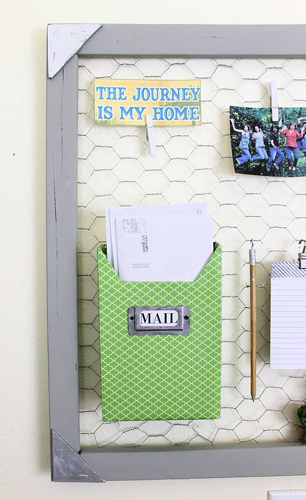 A country chicken wire frame memo board that will brighten up your kitchen with its pretty pinecone succulents. It holds useful items plus photos & quotes!