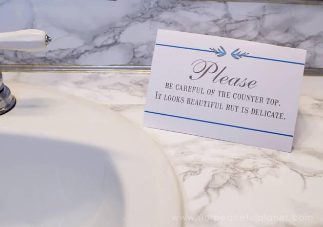 Transform your bathroom for only a few dollars with a contact paper countertop. You'll be amazed at how beautiful it looks & so will your family & guests!