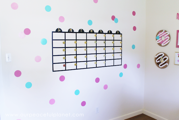 Get organized with this fun huge wall calendar made with Washi tape, large sequins and Post-it notes! It's great for a home offices or a family center!