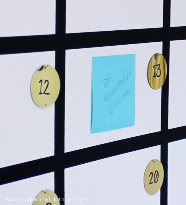 Get organized with this fun huge wall calendar made with Washi tape, large sequins and Post-it notes! It's great for a home offices or a family center!