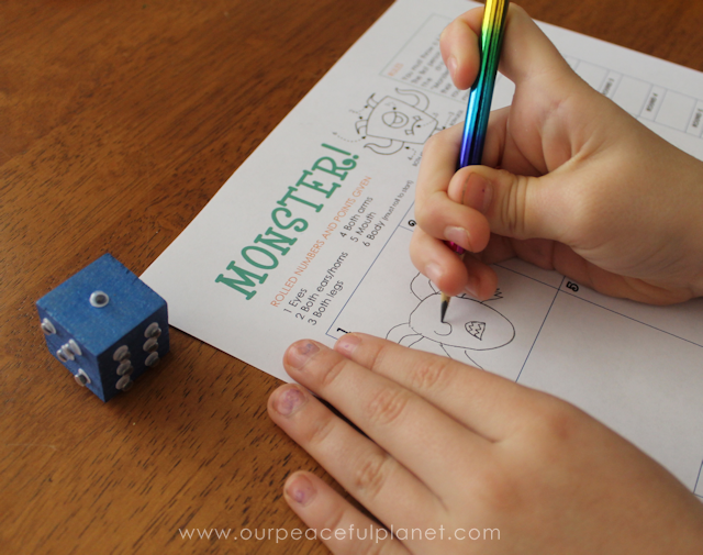 Monster! is a fun Halloween game you can quickly make using our free printables, a wood block and some wiggle eyes. Entertaining for adults and children!
