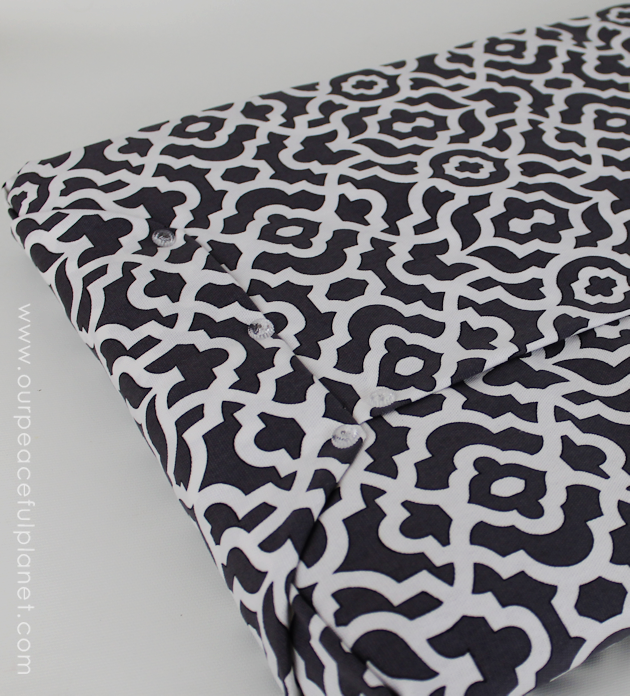 Upholstery pins are are an incredibly simple yet versatile tool for doing some quick no-sew recovering in your home. We recovered a window seat in minutes!