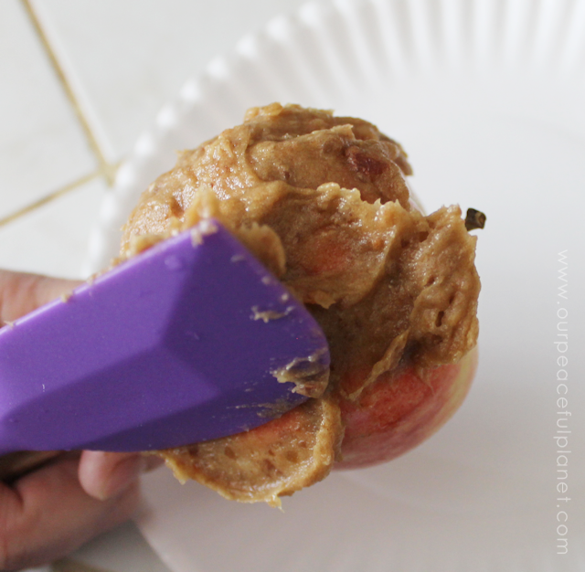 Our Simple Healthy Candy Apple Recipe is quick fall treat that you can feel good about eating and giving the kids. All it takes is apples, dates and nuts!